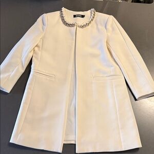 Missguided Ivory Coat with Chain Detail. It’s a UK 8 (US 4 to 6)